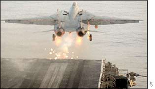 A US Navy F-14 takes off from an aircraft carrier