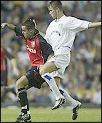 Eirik Bakke, of Leeds, and Zaporizhzhya's Oleg Raty battle for possession