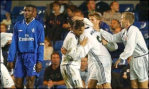 Ben Wright is mobbed by his team-mates after his late goal