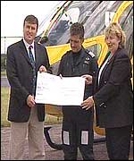 A cheque being presented to the air ambulance