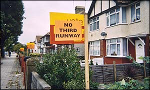 Homes with protest signs posted outside