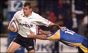 Tristan Davies (right) battles to tackle Sale's Mark Cueto