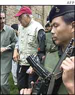 Chief Minister Farooq Abdullah (2nd L) surrounded by commandos after rally