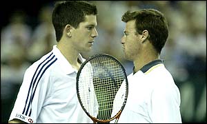 Henman and Maclagan discuss their next move after losing the first set tie-break to trail the Thai pair