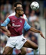 West Ham United's Frederic Kanoute holds off Manchester City's Sun Jihai 