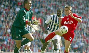 West Brom keeper Russell Hoult brings down Michael Owen in the area