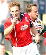 Matthew Watkins celebrates another Llanelli try