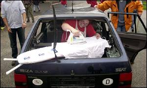 Claire Agnew, 30, a staff nurse from Leicester, irons a shirt during the urban section. 