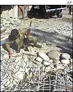 Indian soldier examines scene of attack on Ms Itoo 