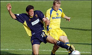 Wimbledon's Rob Gier (left) tackles Coventry's Gary McSheffrey