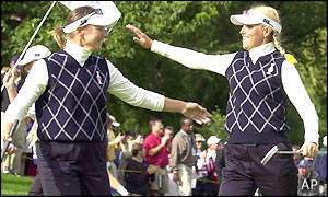 Annika Sorenstam (left) and Carin Koch share a hug after dual victories on day two