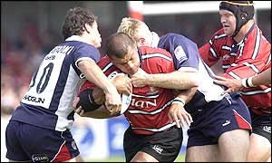 The Bristol defence stop Robert Todd as Gloucester drive forward
