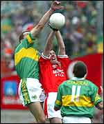 Armagh's midfielder John Toal doing a job in which he is expert