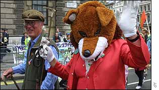 protesters, one dressed as a fox