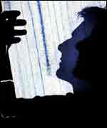 A scientists examines a seismograph of the earthquake