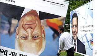 Workers pull down election posters