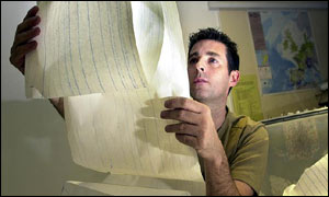 Julian Bukits, of the British Geological Survey in Edinburgh, looks over a chart