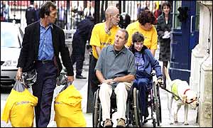 Steve Barksby (in yellow t-shirt pushing wheelchair) and other right-to-die campaigners