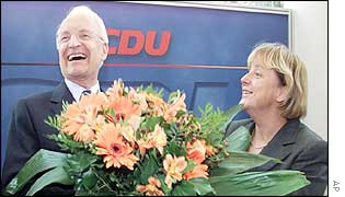 Stoiber receives a bouquet from CDU leader Angela Merkel