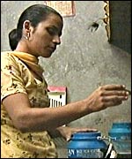 Paramjit Kaur, working in her kitchen