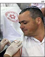 Israeli emergency worker receives vaccine