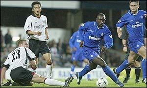 Jimmy Floyd Hasselbaink evades Sean Davis' challenge