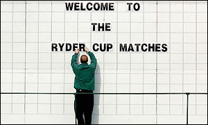 A member of staff prepares the scoreboard