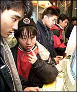 Teenagers using a PC 