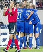 Leverkusen's Zivkovic hold his head in his hands after Man Utd's score their second