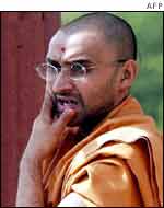 Priest looks on as LK Advani tours the scene