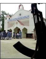 A policeman stands outside a Catholic Church