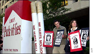 Protestors outside IMF headquarters protest tobacco sales in emerging nations.