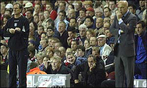 Gerard Houllier sits it out as Christian Gross looks on
