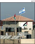 Israeli flag flying from building in Yasser Arafat's compound
