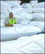 Man stacks the building site bags