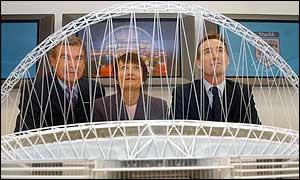 Sport England's Trevor Brooking, Culture secretary Tessa Jowell and Football Association chief executive Adam Crozier admire the design
