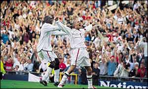 Fans go wild after David Beckham's goal in the World Cup qualifier with Greece at Old Trafford