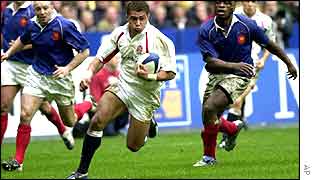 England rugby player running to score a try