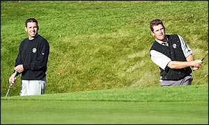 Sergio Garcia and Lee Westwood in a bunker on the 13th hole