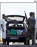 Rebel fighters at a roadblock in Bouake