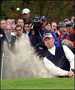 David Duval plays out of a bunker
