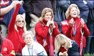 Elin Nordegren leads the cheers for boyfriend Tiger Woods in the opening round