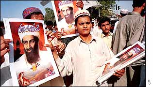 A boy sells posters of al-Qaeda leader Osama Bin Laden