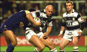 Graham Mackay's run is halted by a tackle from Leeds' Mark Calderwood