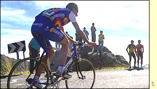 Jose Garcia Acosta rides alone towards the end of the nineteenth stage