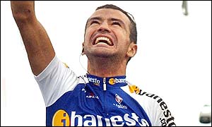 Santiago Blanco of the Ibanesto team celebrates winning the 18th stage