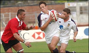 Swansea centres Mark Taylor and Scott Gibbs break through