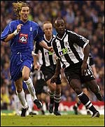 Birmingham's Robbie Savage (left) and Lomana Lua Lua of Newcastle race for the ball at St Andrews