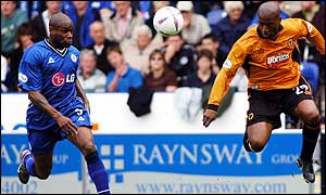 Frank Sinclair (left) and Dean Sturridge compete for the ball