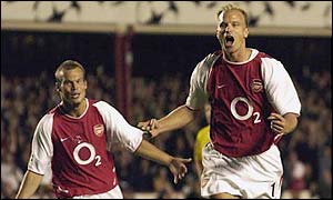 Dennis Bergkamp celebrates his goal against Borussia Dortmund